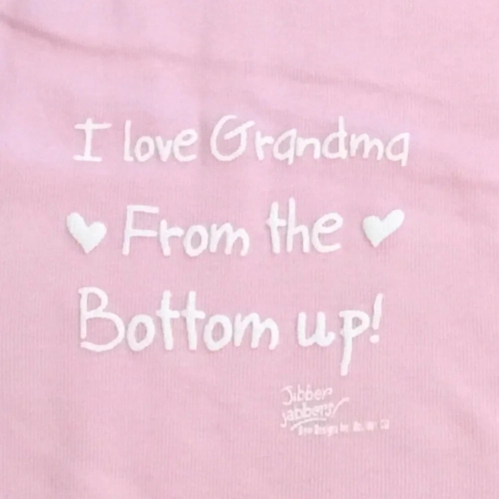 Pink Baby One-Piece Bodysuit w/White Print “I Love Grandma From The Bottom Up!”.